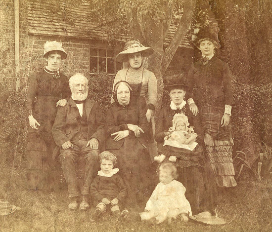Photograph by Henry James Nobes taken about 1881/2 of his wife Helena Nobes (sitting), with three of their children and her parents. The three ladies standing at the back are probably family members